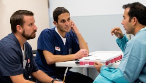 Cook Surgery’s Chris and Amro listen to a surgeon.