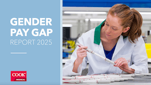 cover of Cook Medical Limerick Gender Pay Gap Report 2025 showing an employee in a white lab jacket inspecting a medical device, linking to the report PDF file